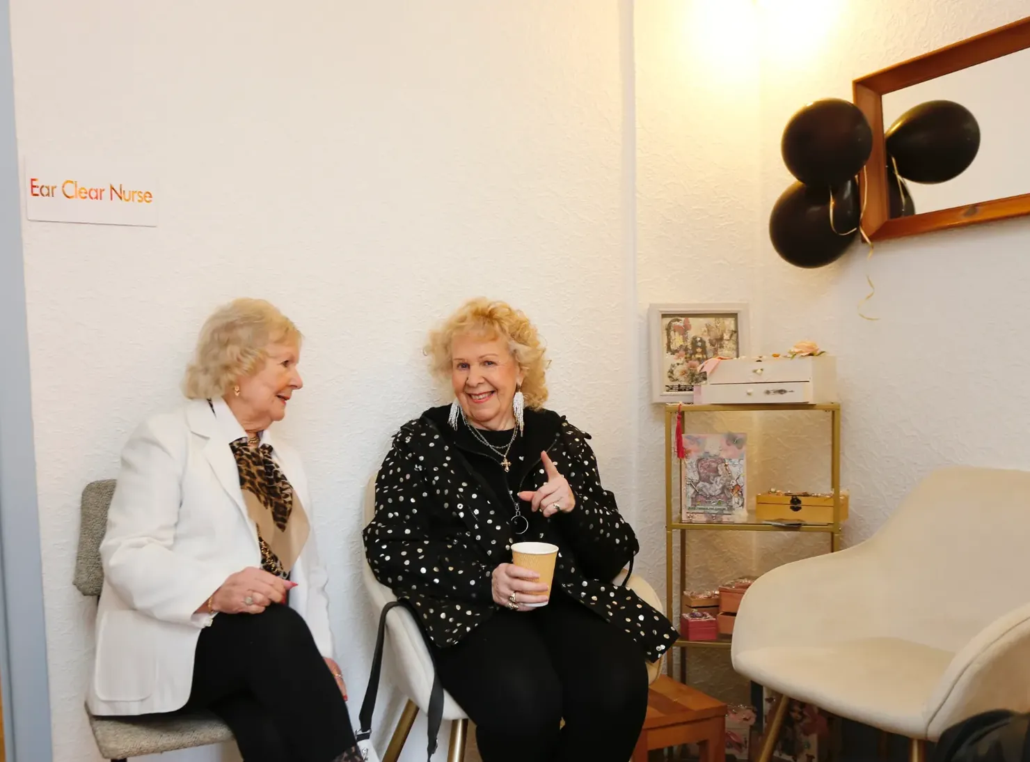 Two visitors chatting in the clinic